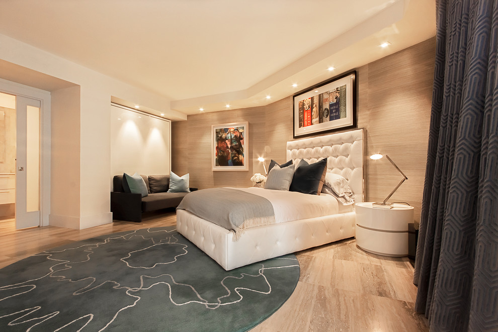 Mid-sized minimalist guest travertine floor bedroom photo in Miami with beige walls