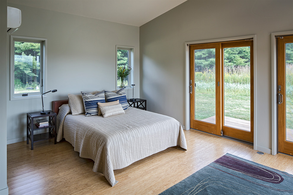 Photo of a medium sized contemporary master bedroom in San Francisco with beige walls and bamboo flooring.