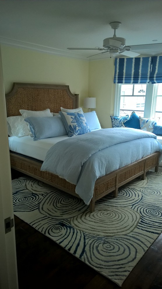Inspiration for a medium sized classic master bedroom in Orange County with yellow walls and medium hardwood flooring.