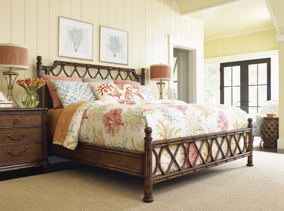 Bedroom - large coastal master medium tone wood floor bedroom idea in Orange County with yellow walls