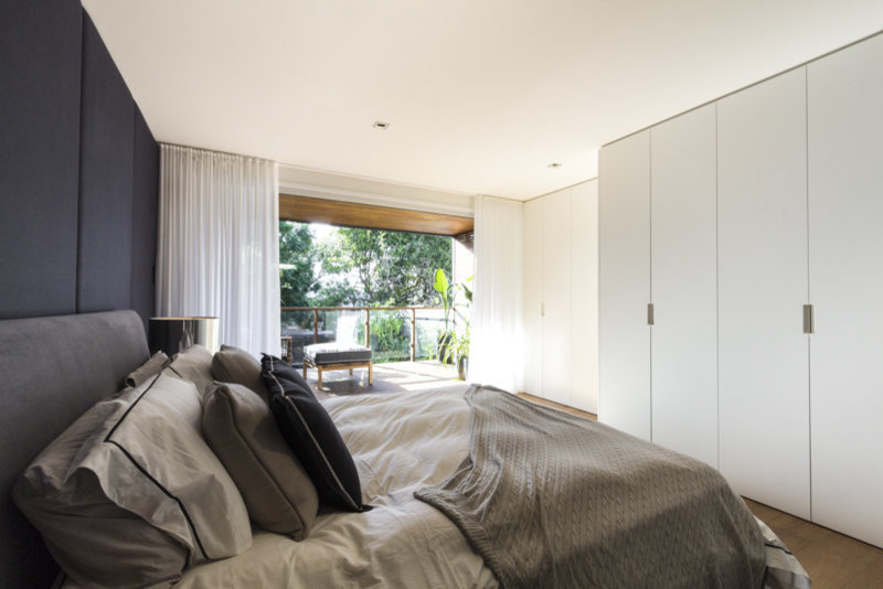 Inspiration for a mid-sized contemporary master bedroom remodel in Sydney with white walls and no fireplace