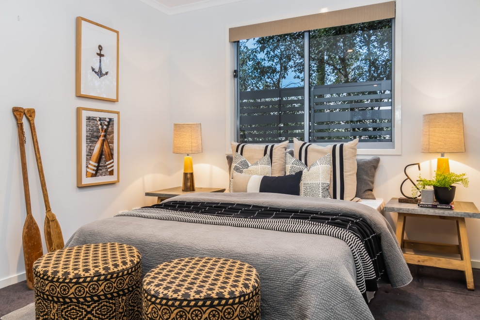 This is an example of a beach style bedroom in Brisbane.
