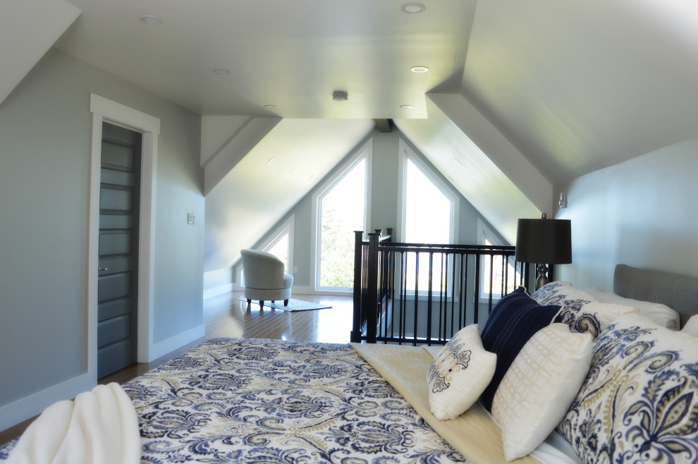 Beach style loft-style light wood floor, beige floor and vaulted ceiling bedroom photo in Other with gray walls