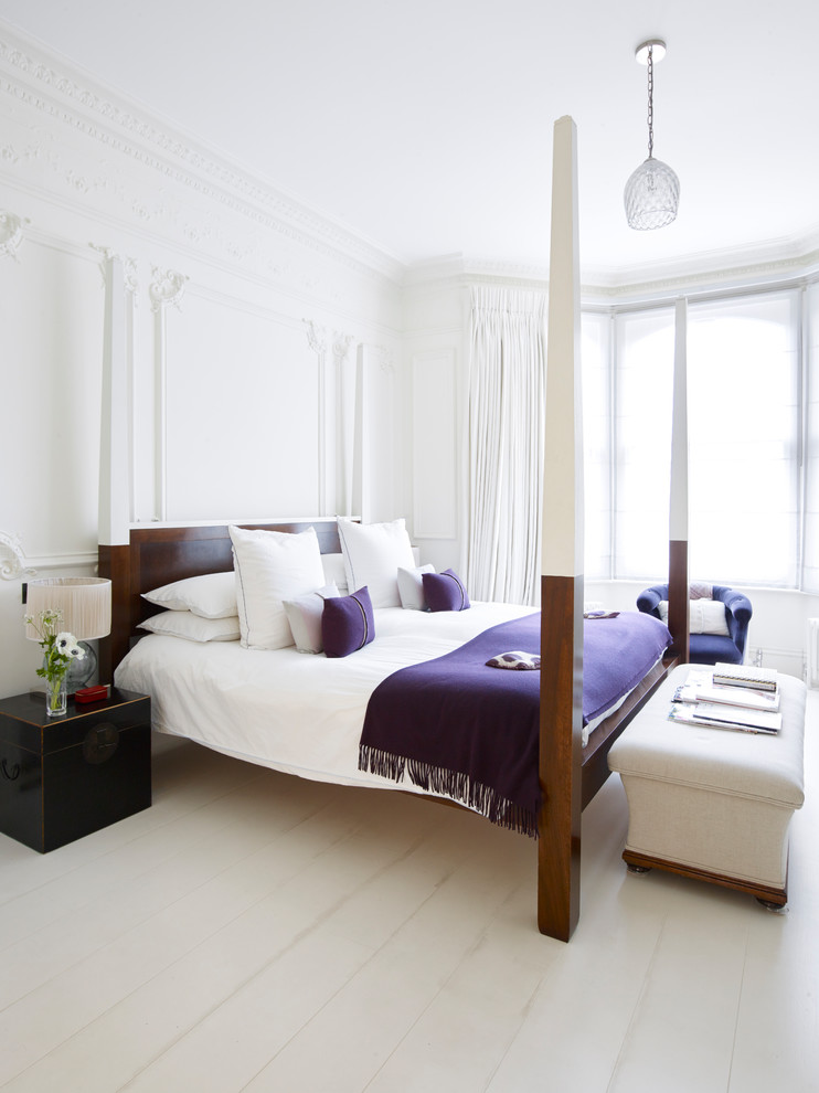 Medium sized classic bedroom in London with white walls, light hardwood flooring and white floors.