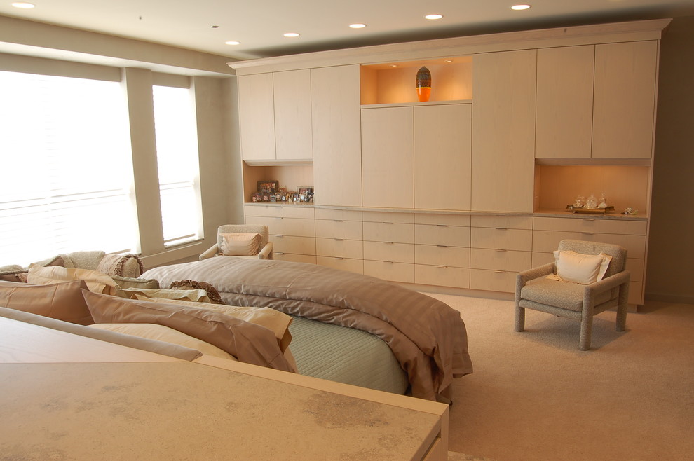 Contemporary bedroom in Chicago with beige walls, carpet and beige floors.