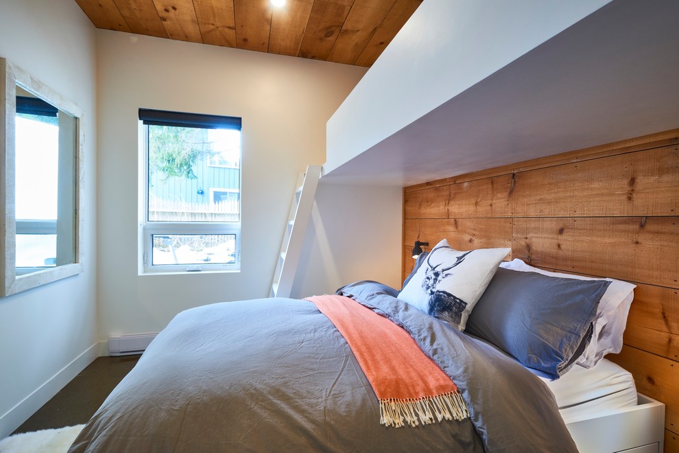 トロントにあるコンテンポラリースタイルのおしゃれな寝室 (白い壁、コンクリートの床、グレーの床)