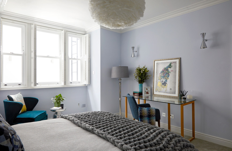 This is an example of a traditional grey and silver bedroom in London with purple walls, carpet and grey floors.