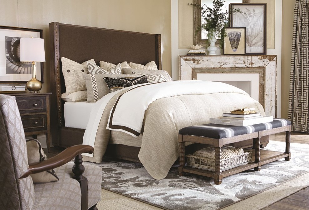 Large country master dark wood floor bedroom photo in Jacksonville with brown walls, a standard fireplace and a plaster fireplace
