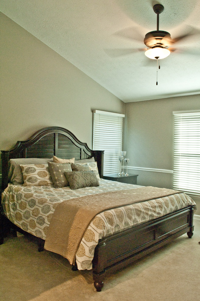 Medium sized traditional master bedroom in Grand Rapids with grey walls and carpet.