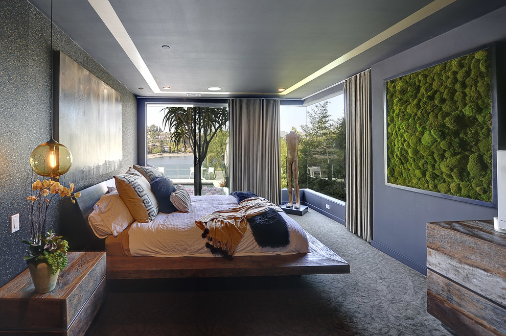 Bedroom - large contemporary guest carpeted bedroom idea in Los Angeles with black walls