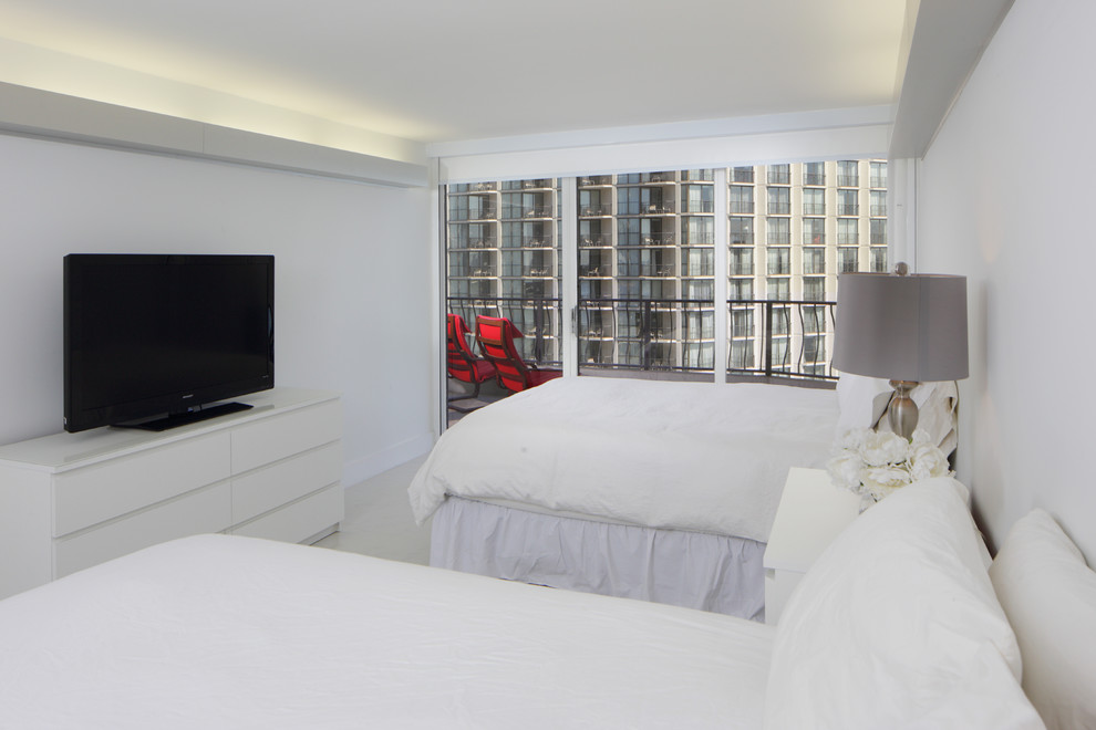 Inspiration for a transitional porcelain tile bedroom remodel in Miami with white walls
