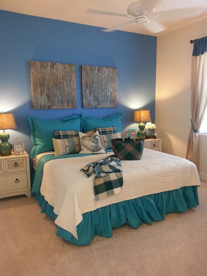 Mid-sized beach style guest carpeted bedroom photo in Tampa with blue walls and no fireplace