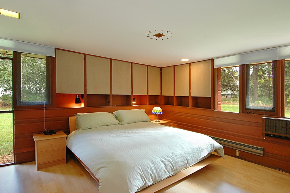 Photo of a modern bedroom in Milwaukee.