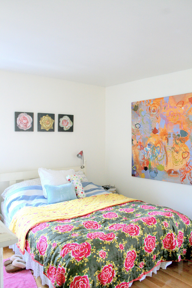 This is an example of an eclectic bedroom in Burlington with white walls.