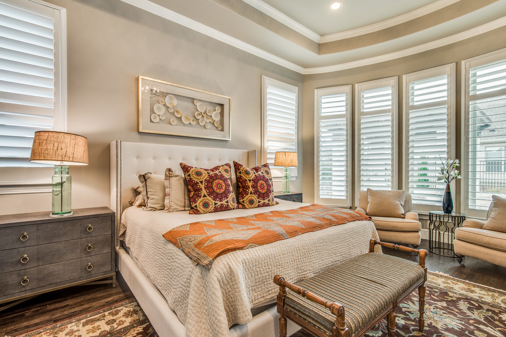 Photo of a nautical master bedroom in Dallas with beige walls, dark hardwood flooring and brown floors.