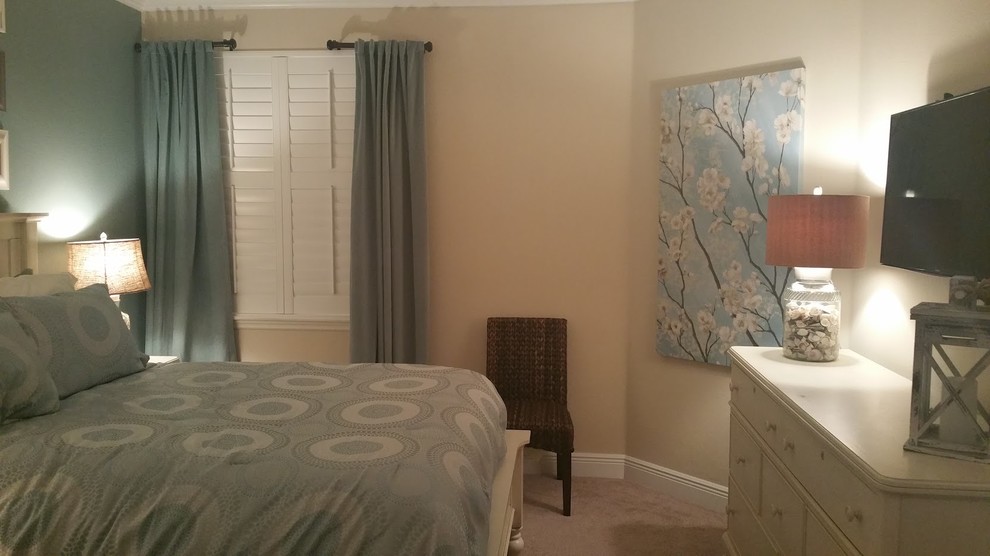 Nautical master bedroom in Atlanta with green walls, carpet and beige floors.