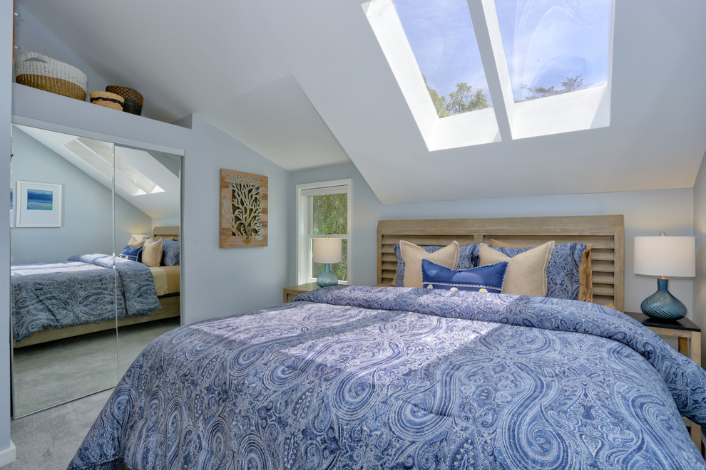 Design ideas for a nautical master bedroom in Other with blue walls, carpet and grey floors.