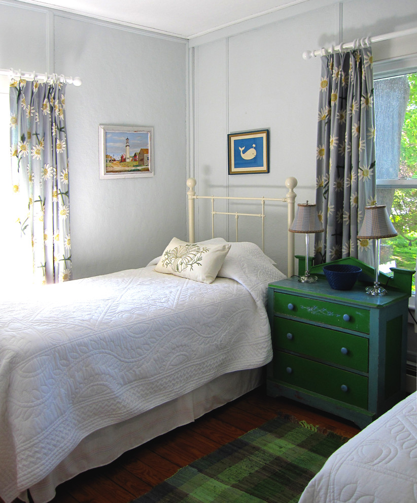 Bedroom - mid-sized coastal guest medium tone wood floor bedroom idea in New York with blue walls