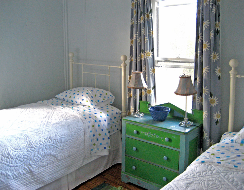Design ideas for a medium sized coastal guest bedroom in New York with blue walls and medium hardwood flooring.