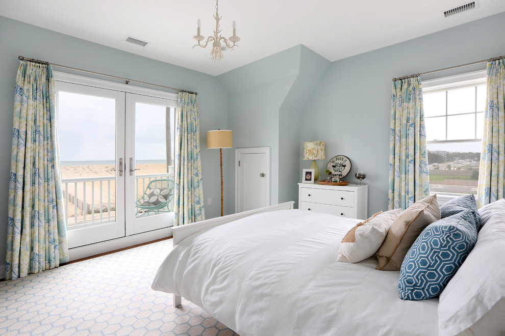 Photo of a medium sized beach style guest bedroom in Other with blue walls and medium hardwood flooring.
