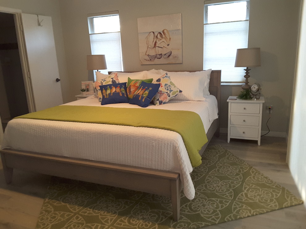 Bedroom - small coastal master light wood floor and beige floor bedroom idea in Orange County with beige walls and no fireplace