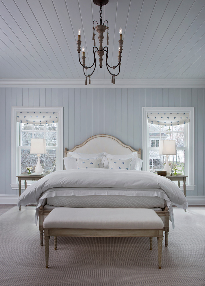 Inspiration for a large coastal gray floor bedroom remodel in Other with blue walls