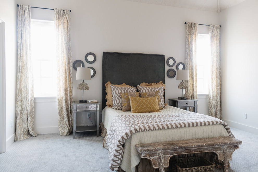 Example of a beach style carpeted and gray floor bedroom design in Birmingham with beige walls and no fireplace