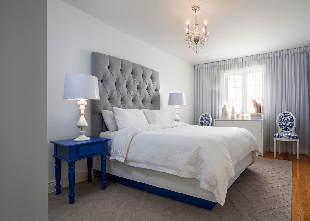 Medium sized classic master bedroom in Toronto with white walls and medium hardwood flooring.