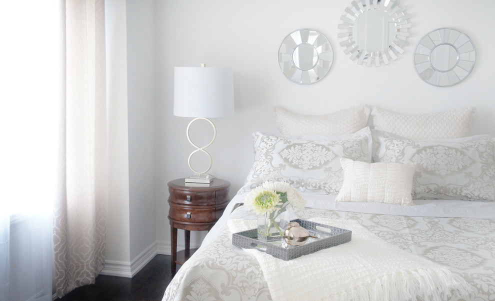Medium sized classic master bedroom in Toronto with beige walls, medium hardwood flooring and no fireplace.