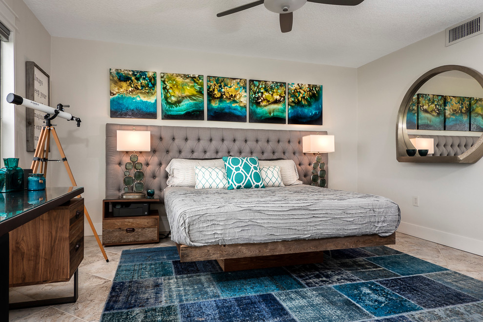 This is an example of a beach style bedroom in Jacksonville with grey walls.