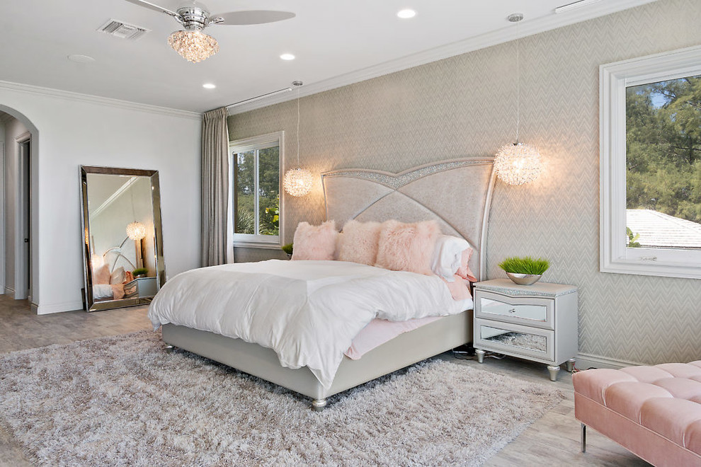 Design ideas for a contemporary grey and pink bedroom in Miami with grey walls and grey floors.