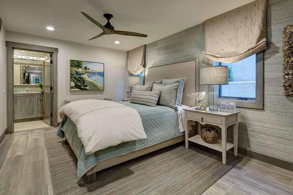 Design ideas for a medium sized beach style guest bedroom in Orange County with white walls, porcelain flooring and grey floors.