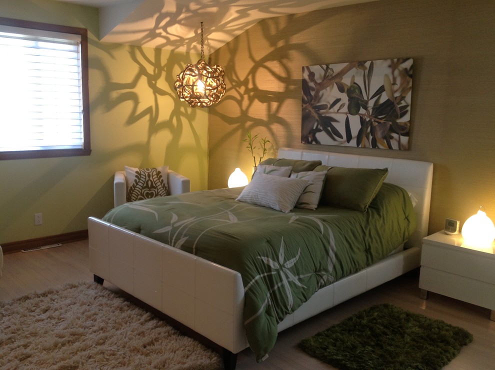 Large trendy light wood floor bedroom photo in Montreal with green walls and no fireplace