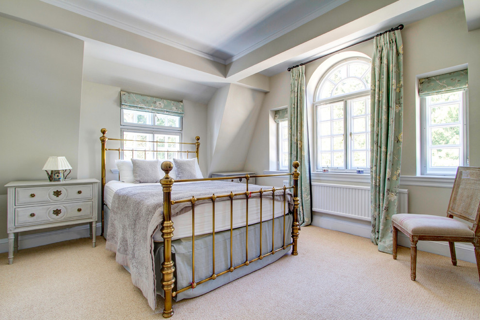 Master bedroom in Wiltshire with grey walls and carpet.