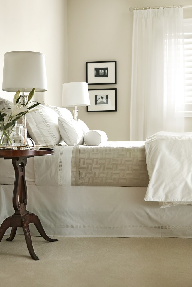 Elegant carpeted bedroom photo in Toronto with beige walls