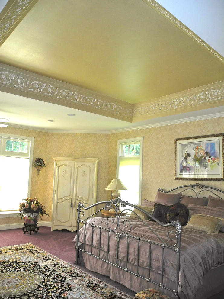 Inspiration for a large classic master bedroom in Philadelphia with beige walls and carpet.