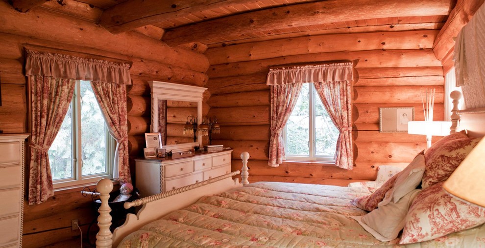 Immagine di una camera degli ospiti stile rurale di medie dimensioni con pareti marroni e nessun camino