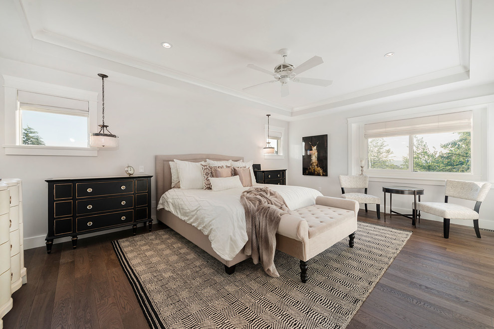 Inspiration for a large transitional master dark wood floor bedroom remodel in Vancouver with white walls and no fireplace