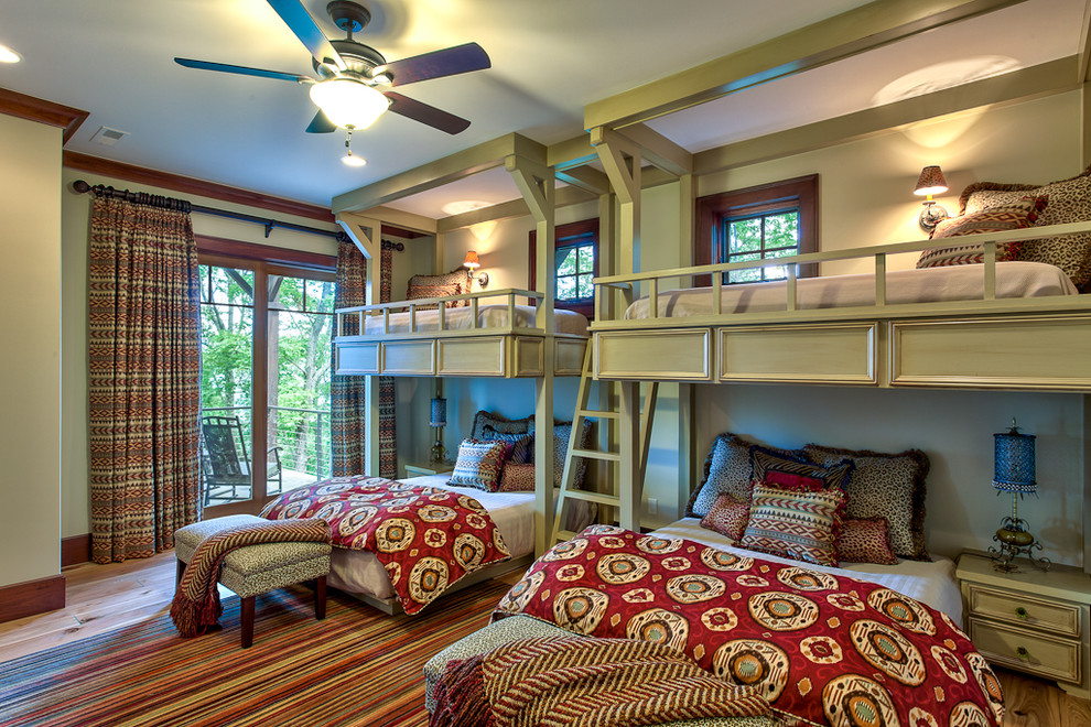 Inspiration for a timeless medium tone wood floor bedroom remodel in Other with green walls