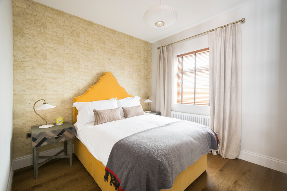 Bedroom - transitional medium tone wood floor bedroom idea in London with multicolored walls