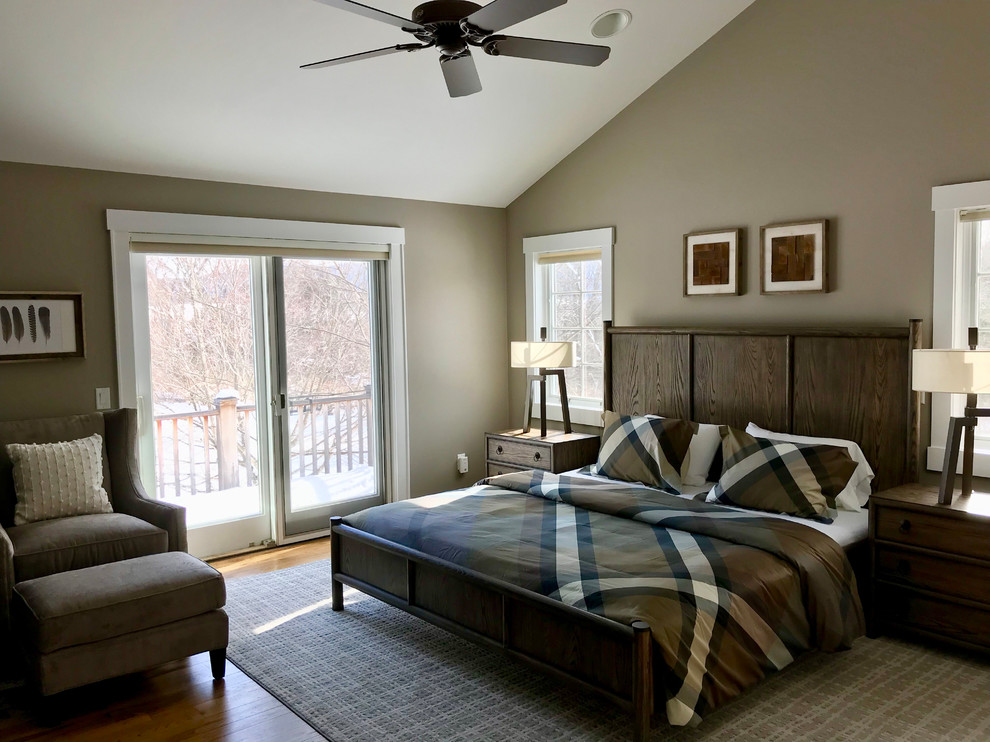 Photo of a medium sized farmhouse master bedroom in New York with beige walls and medium hardwood flooring.
