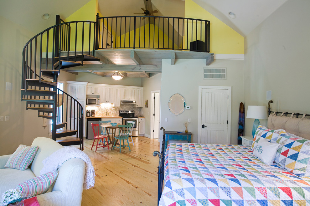 Medium sized rural bedroom in Little Rock with beige walls, medium hardwood flooring, no fireplace and feature lighting.