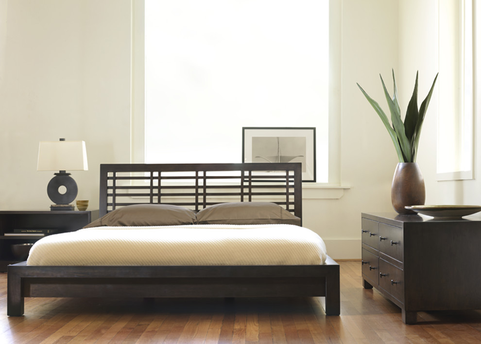 Design ideas for a contemporary bedroom in Philadelphia with white walls, medium hardwood flooring and no fireplace.