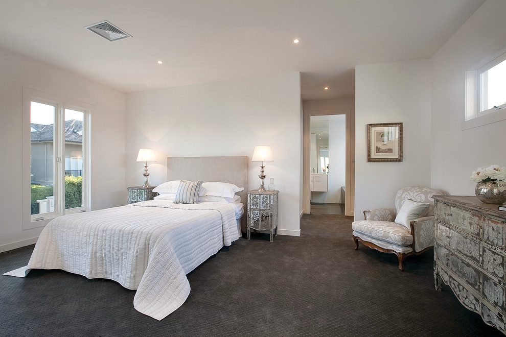 Example of a mid-sized trendy master carpeted bedroom design in Melbourne with white walls and no fireplace