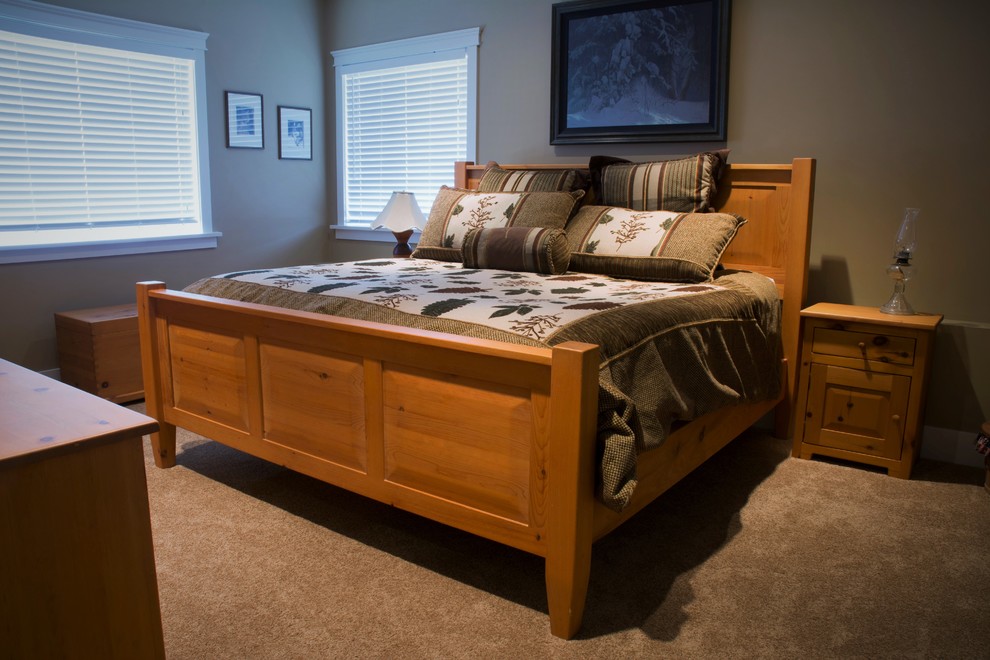 Example of a mid-sized classic guest carpeted bedroom design in Calgary with beige walls and no fireplace