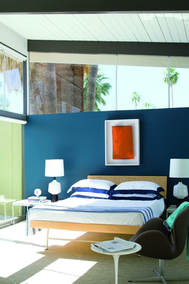 Large contemporary master bedroom in San Diego with blue walls, carpet and no fireplace.