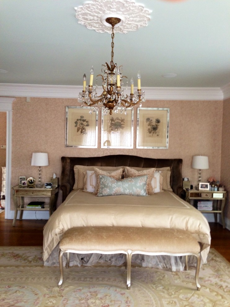 Inspiration for a large classic master bedroom in New York with pink walls.