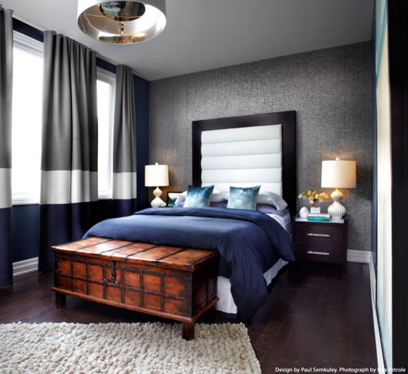 Medium sized contemporary master bedroom in New York with grey walls, dark hardwood flooring and no fireplace.