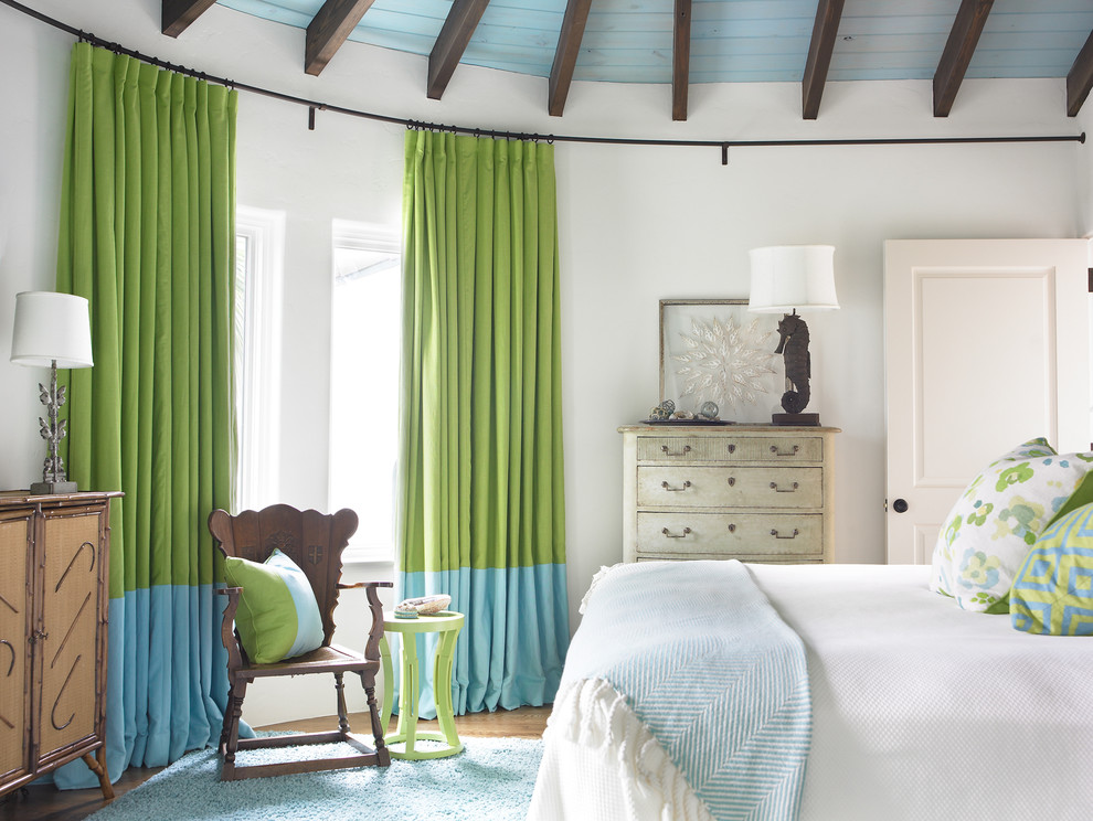 Example of a beach style bedroom design in Atlanta with white walls