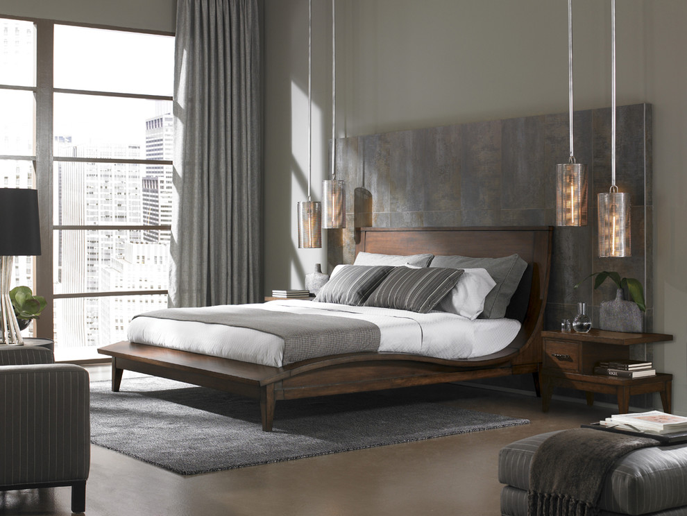 Foto de dormitorio principal de tamaño medio con paredes grises y suelo de cemento